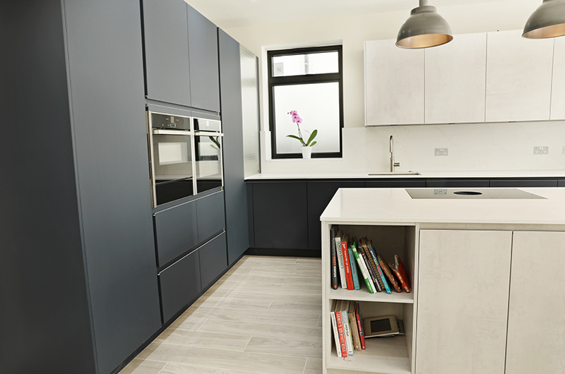 Pronorm Y-line Handless in Midnight Blue & Oxide concrete with Cimstone Cortina 20mm worktop. • Neff N 70 Single Pyrolytic Oven CircoTherm • Neff N 70/90 14cm high, warming drawer, 4 settings • Neff N 70 Compact 45cm Oven with Microwave CircoTherm • Neff N 50 177x54 built in fridge, FreshSafe • Neff N 50 Fully Integrated 60cm Dishwasher 6 programmes • PURU BORA Pure induction cooktop with integrated extraction • BLANCO CLARON 550-U, Stainless Steel Sink • Quooker PRO3 Flex Stainless steel Tap • Quooker Cold Water Filter • BLANCO FWD Medium (food waste disposal) • Blanco Foldable Grid Drainer