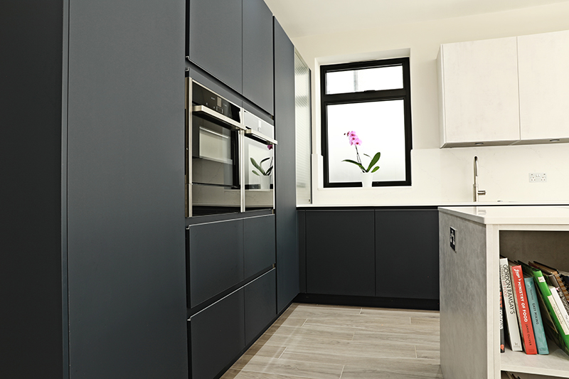 Pronorm Y-line Handless in Midnight Blue & Oxide concrete with Cimstone Cortina 20mm worktop. • Neff N 70 Single Pyrolytic Oven CircoTherm • Neff N 70/90 14cm high, warming drawer, 4 settings • Neff N 70 Compact 45cm Oven with Microwave CircoTherm • Neff N 50 177x54 built in fridge, FreshSafe • Neff N 50 Fully Integrated 60cm Dishwasher 6 programmes • PURU BORA Pure induction cooktop with integrated extraction • BLANCO CLARON 550-U, Stainless Steel Sink • Quooker PRO3 Flex Stainless steel Tap • Quooker Cold Water Filter • BLANCO FWD Medium (food waste disposal) • Blanco Foldable Grid Drainer